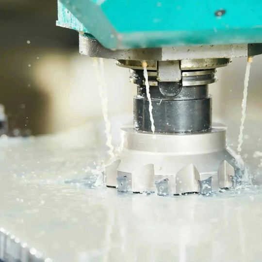 Industrial setting showing the application of coolant in machinery, illustrating the vital role of coolant in maintaining machine temperature and efficiency.
