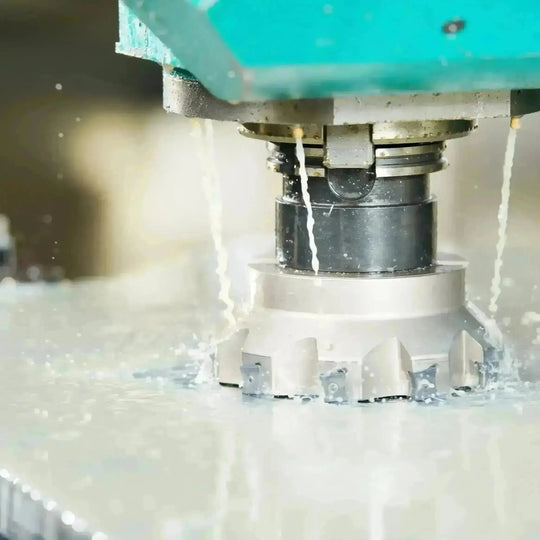 Industrial setting showing the application of coolant in machinery, illustrating the vital role of coolant in maintaining machine temperature and efficiency.