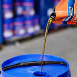 Close-up view of XDP1000 soluble cutting fluid bottle, emphasising its application and benefits in industrial cutting operations.